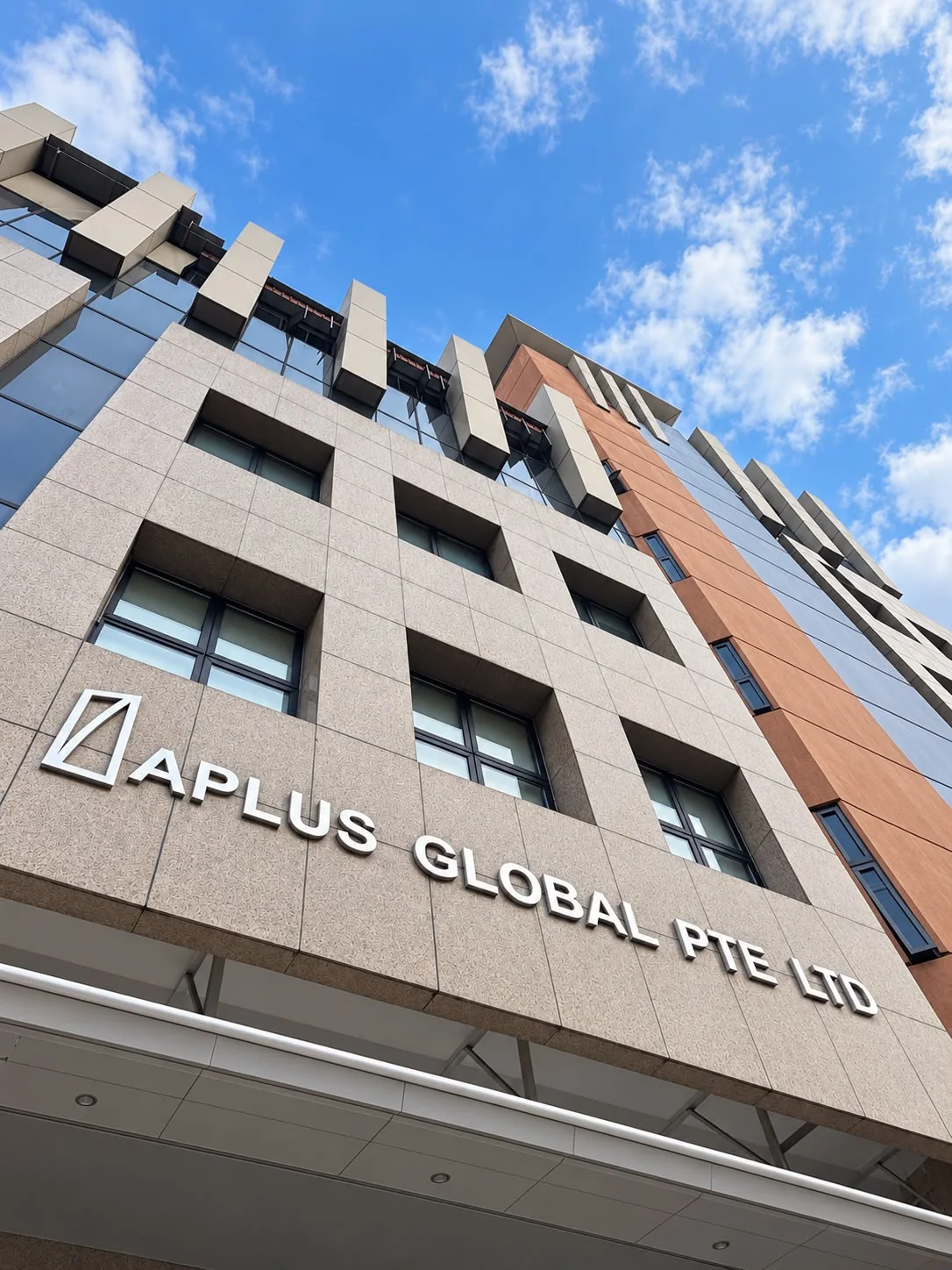Aplus Global Singapore office exterior with the APLUS GLOBAL PTE LTD sign